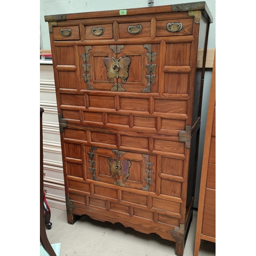 448 - An early 20th century Korean Tansu 'marriage' chest on chest with brass bindings and butterfly finge... 