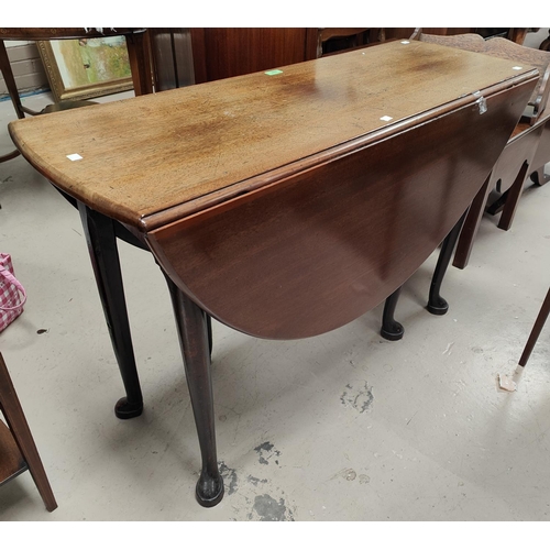 897 - A mid 18th century mahogany dining table with oval drop leaf top, on pad feet, length 128cm