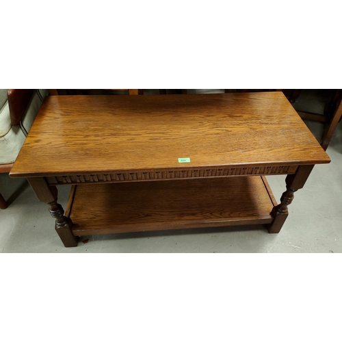 920 - An oak 2 tier coffee table; a nest of 3 oak occasional tables