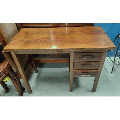 922 - A 1930's oak kneehole desk and office armchair