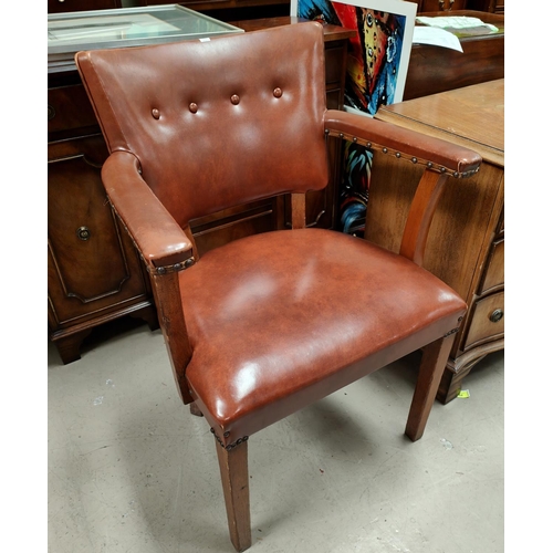 922 - A 1930's oak kneehole desk and office armchair