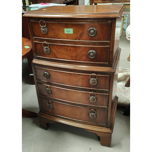 949 - A reproduction figured mahogany dwarf 5 height chest on chest  by 