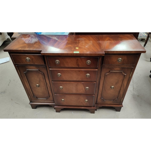 950 - A reproduction figured mahogany dwarf breakfront side cabinet by 