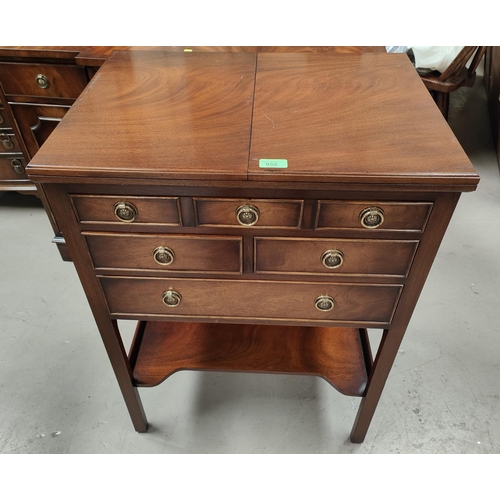 952 - A reproduction figured mahogany occasional table/fitted canteen box with fold out top, 4 drawers and... 