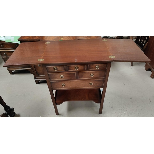 952 - A reproduction figured mahogany occasional table/fitted canteen box with fold out top, 4 drawers and... 