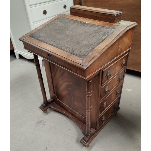 978 - A mahogany Davenport with hinged writing slope, leather writing surface, drawers to one side