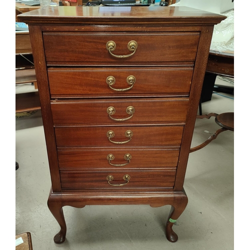 979 - An Edwardian music cabinet with fall front drawers, cabriole legs