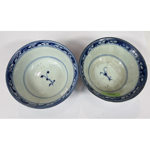 406 - A pair of Chinese 18th century blue and white bowls with scrolling floral underglaze designs, seal m... 