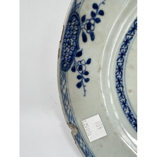 408 - A pair of Chinese 18th century blue and white plates with central floral display, dia. 23.5cm (chips... 