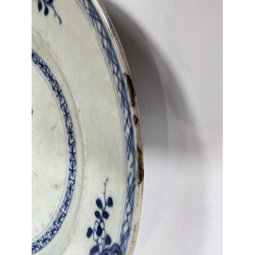 408 - A pair of Chinese 18th century blue and white plates with central floral display, dia. 23.5cm (chips... 