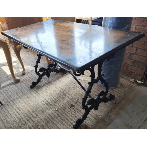 1002 - A large 19th century cast metal based pub table with lyre supports