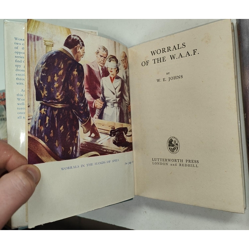 352 - CAPTAIN W.E. JOHNS: Four Worrals first edition novels published by Lutterworth Press, 'Worrals Flies... 