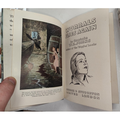 352 - CAPTAIN W.E. JOHNS: Four Worrals first edition novels published by Lutterworth Press, 'Worrals Flies... 