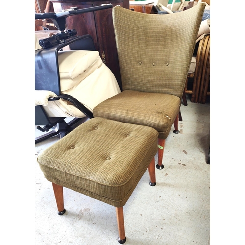 966 - A mid 20th century wing back chair with stool