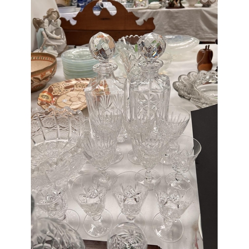 528 - A liqueur set; decanters; a cut glass vase; drinking glasses; etc.