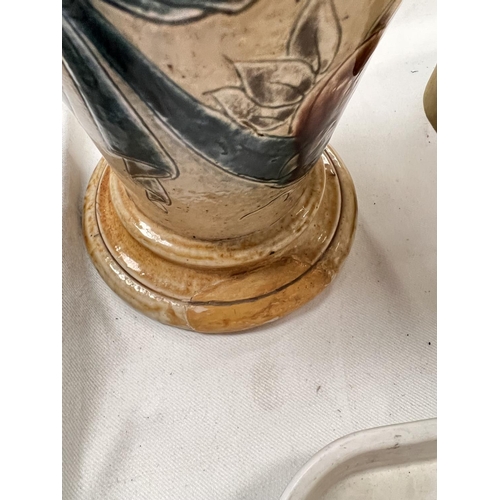 538 - A tall tapering stoneware jug by Martin Bros, the neck decorated with flying birds, the lower body w... 