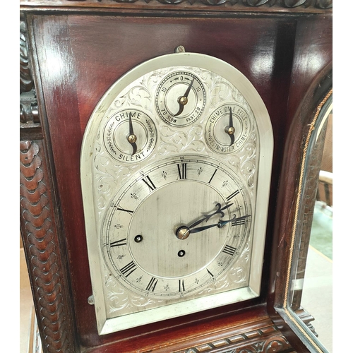 199 - A late 19th century large impressive bracket clock in carved mahogany case with caddy top, chased an... 