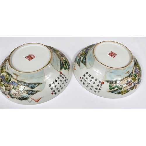 441 - Two Chinese porcelain bowls with matching polychrome decoration of river and mountain scenes with te... 