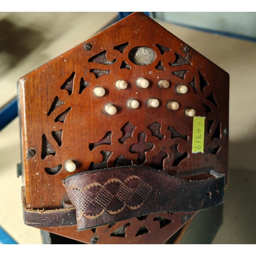 284 - A 19th century concertina by Lachenal, 10 buttons to each end, with fretwork back and front, origina... 