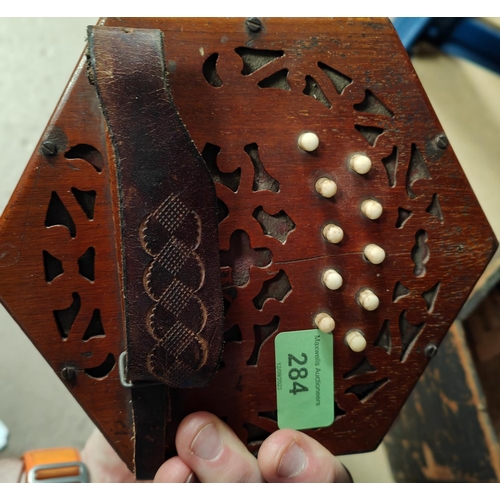 284 - A 19th century concertina by Lachenal, 10 buttons to each end, with fretwork back and front, origina... 