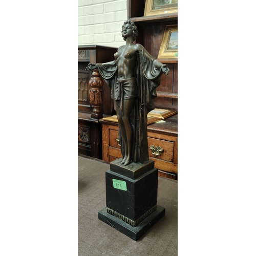 815 - An Art Deco style bronze figure of a young woman with outstretched arms and flowing robe, with circu... 