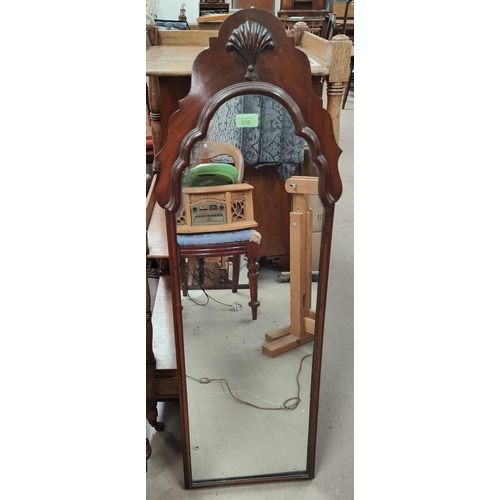 936 - A mahogany period style pier mirror, the frame with shaped arched top and shell frieze; a 19th centu... 