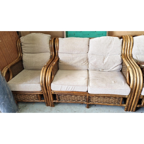 1053 - A bamboo effect conservatory suite comprising 2 seater settee, pair of armchairs and a coffee table