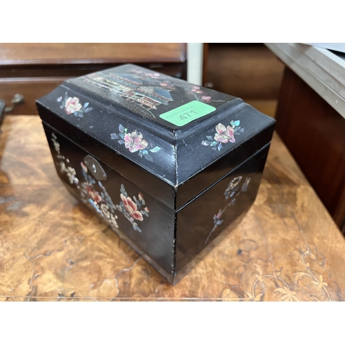 471 - A Japanese Meiji period lacquer tea caddy inlaid with mother of pearl, building to top and flowers a... 