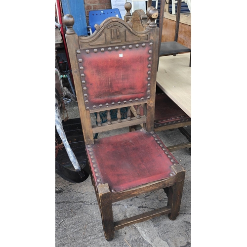 1001 - A pair of large gothic style high back stained wood chairs with leather effect studded back and seat