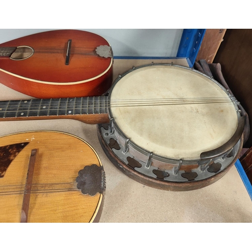 279 - A vintage 5 string banjo and two vintage mandolins