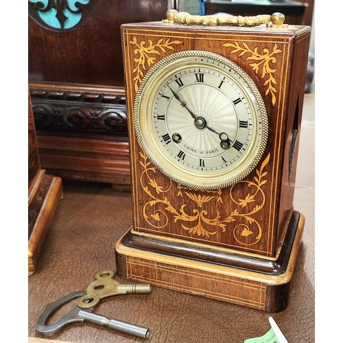 45 - A 19th century French mantle clock in inlaid rosewood case with silvered dial and striking movement ... 