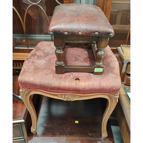 984B - A small footstool with red hide cover and another and a French style stool in red embossed fabric an... 