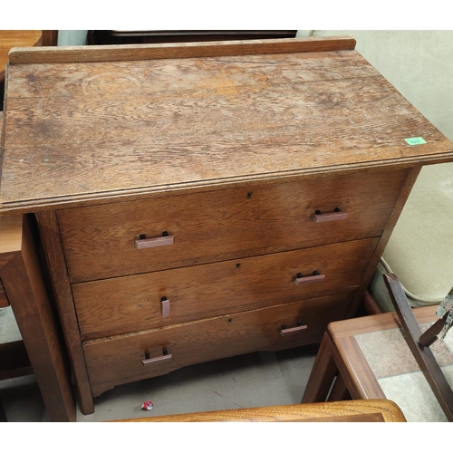 1011 - A 1930's oak chest of three charms with Bakelite handles; a smaller walnut bedroom chest with chrome... 