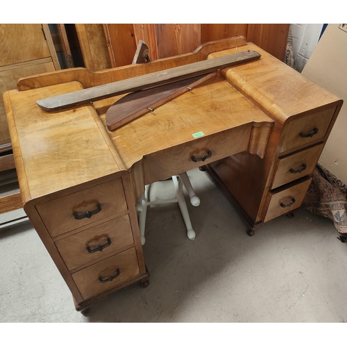 1013 - An Art Deco walnut dressing table with triple shaped mirror and 7 drawers below, length 108 x ht. 16... 