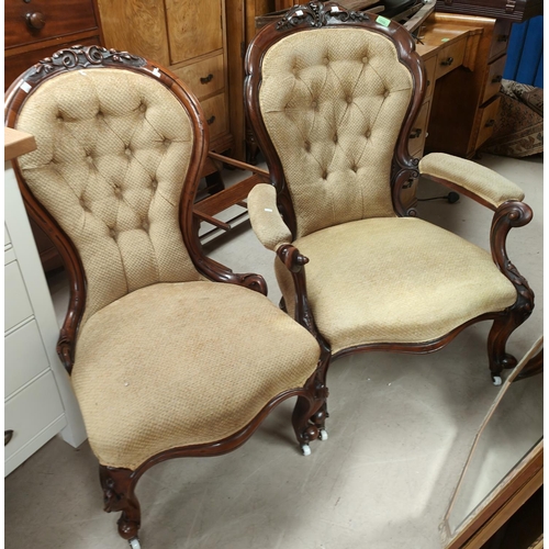 1056 - A Victorian pair of ladies and gents spoon back chairs in carved walnut on knurled feet and cas... 