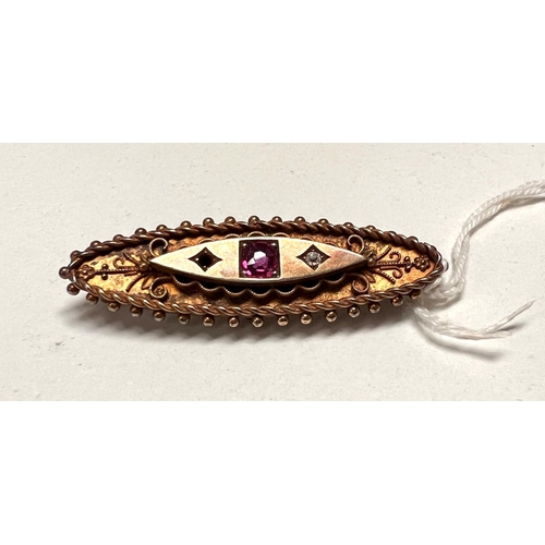 649 - An Edwardian yellow metal bar brooch, boat shaped with beaded filigree decoration, set central ruby ... 