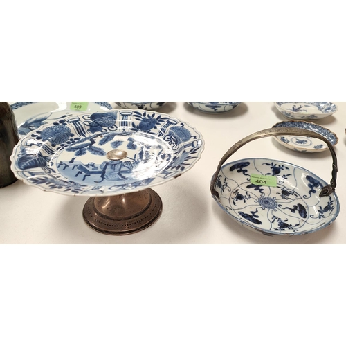 404 - A Chinese 18th century blue and white plate with shaped rim, traditional central scene with basket m... 