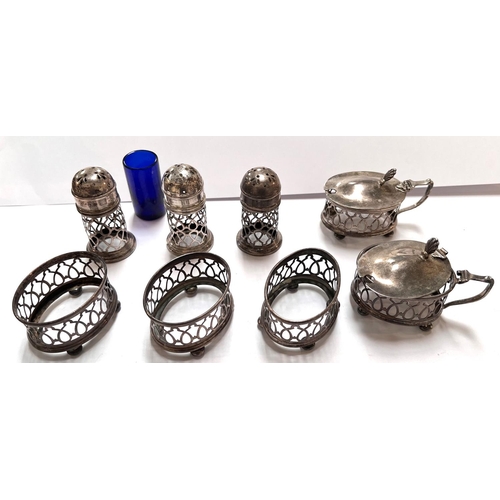 632 - A hallmarked silver 8 piece part cruet set with extensive pierced decoration:  3 salts, 3 peppe... 