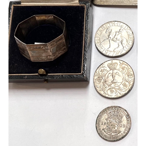 633 - A hallmarked silver napkin ring; hallmarked silver cutlery; 3 coins various dates, 5oz