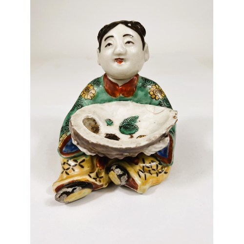 558 - A Chinese ceramic polychrome figure of seated girl holding very large oyster shell decorated with se... 