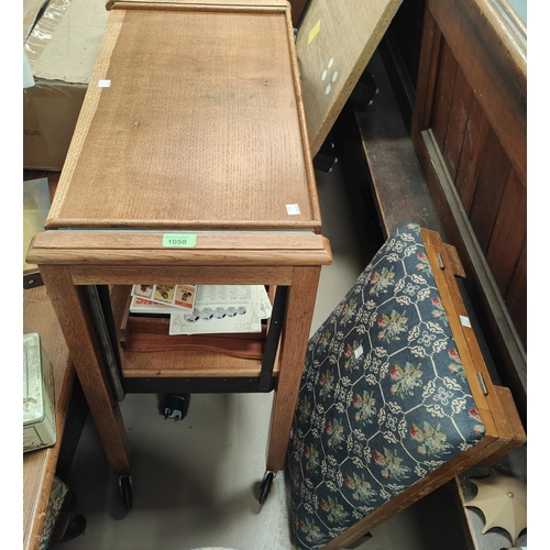 879 - An oak 2 tier trolley/table; an adjustable gout stool with needlework upholstery