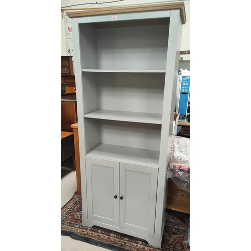 1004 - A modern painted full height bookcase with doors below