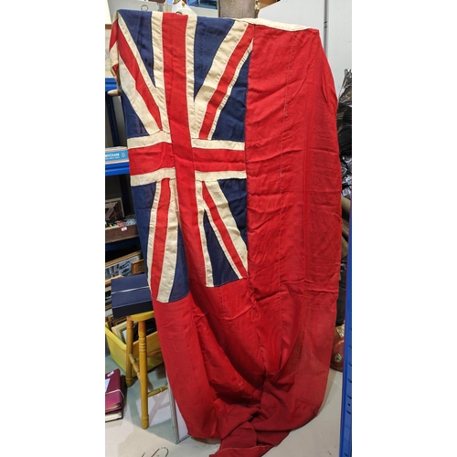 123 - A vintage ensigns flag, a brass telescope and other similar collectables