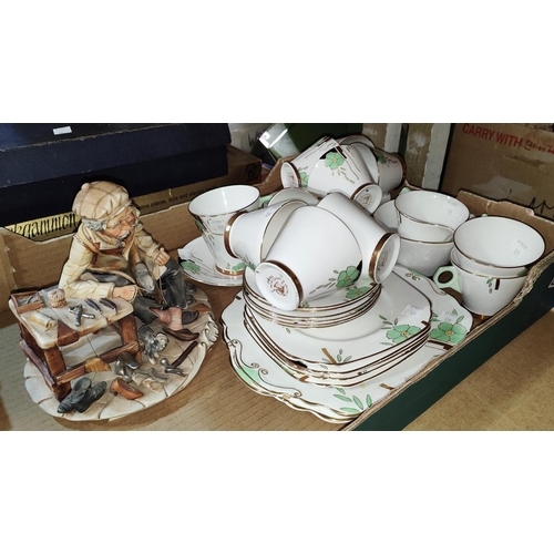 129 - An Art Deco Wellington part tea service, 40 pieces approx. + A Capodimonte group: Shoemaker