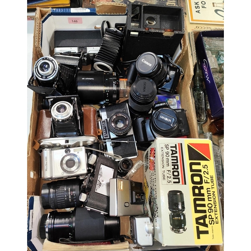 146 - A collection of vintage SLR and other cameras, lenses and other accessories etc