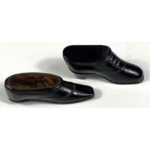 156B - Two 19th century novelty lacquered snuffboxes in the form of shoes, one silver inlaid, one with pict... 