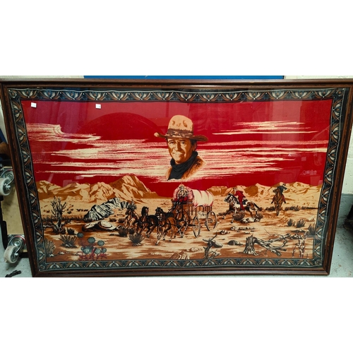 173B - A large framed wall hanging/shawl of John Wayne above a Western scene