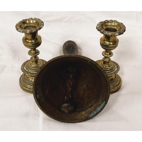 184 - A vintage brass hand bell and two 19th century brass candlesticks