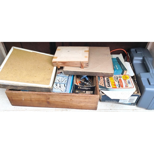 194 - A vintage work bench with attached clamps, vintage cupboard with tools, chisels etc