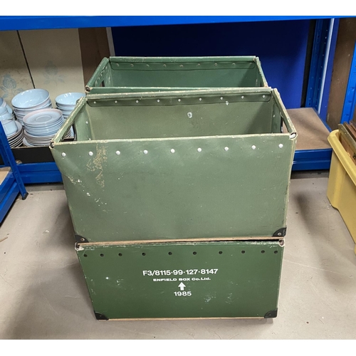 195D - Four military carry crates with arrows and codes.